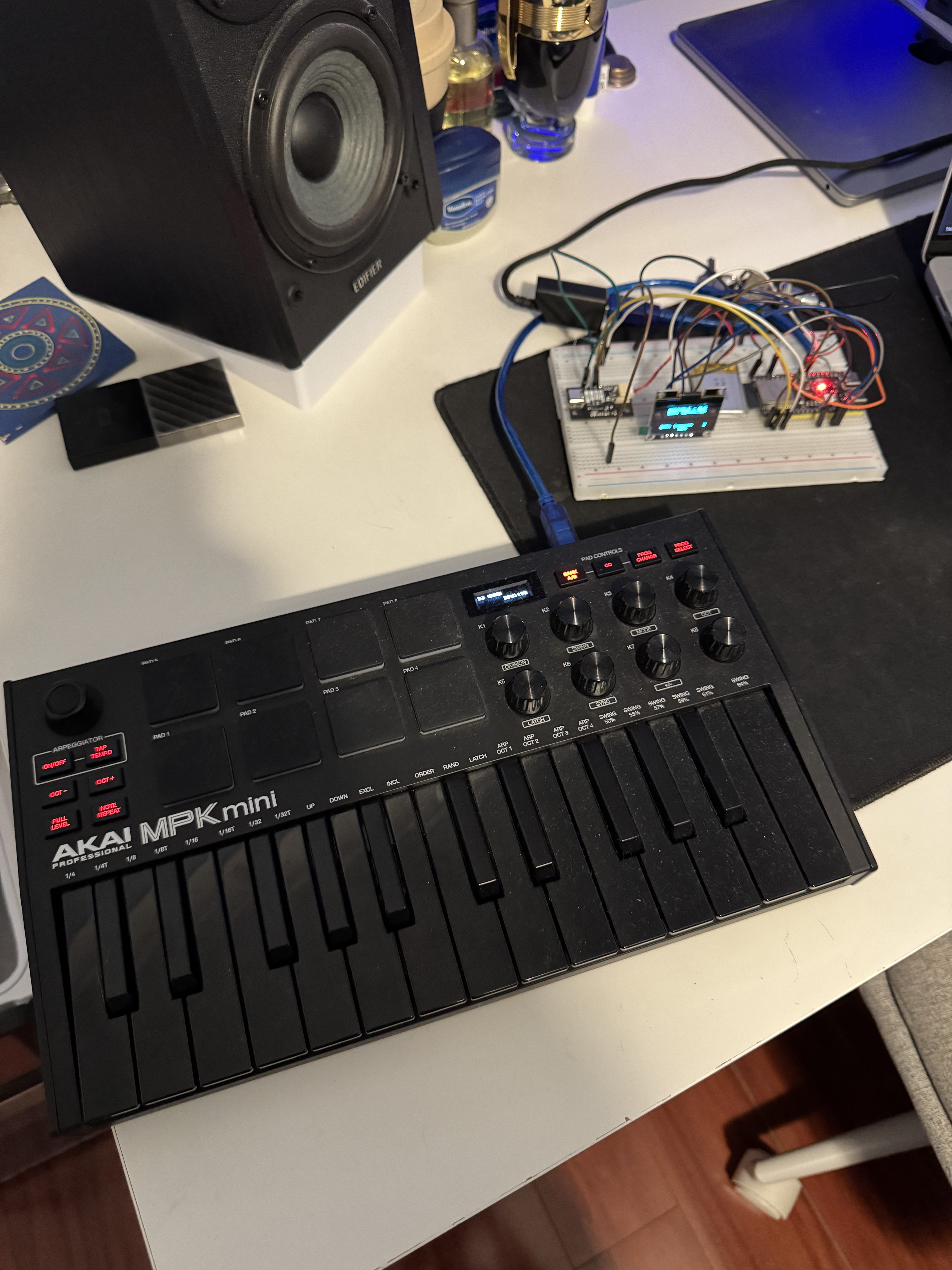 Akai MPK Mini III keyboard with midi2BLE breadboard prototype in the background